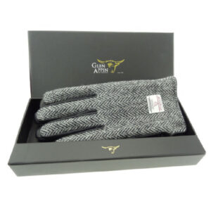 Herrenhandschuhe aus schwarzem Leder und Harris Tweed, verpackt in einer schwarz-weißen Fischgrätbox